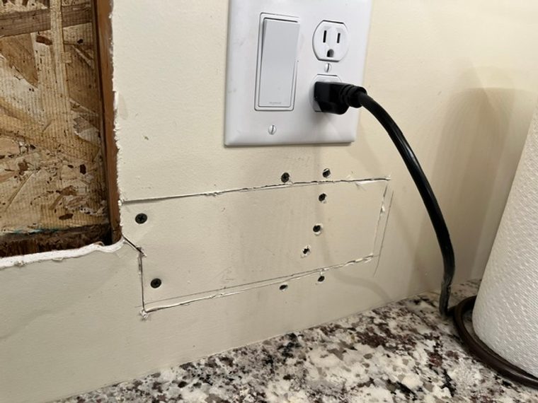 Outlet replacement work by Triple Check Electric in an Omaha kitchen