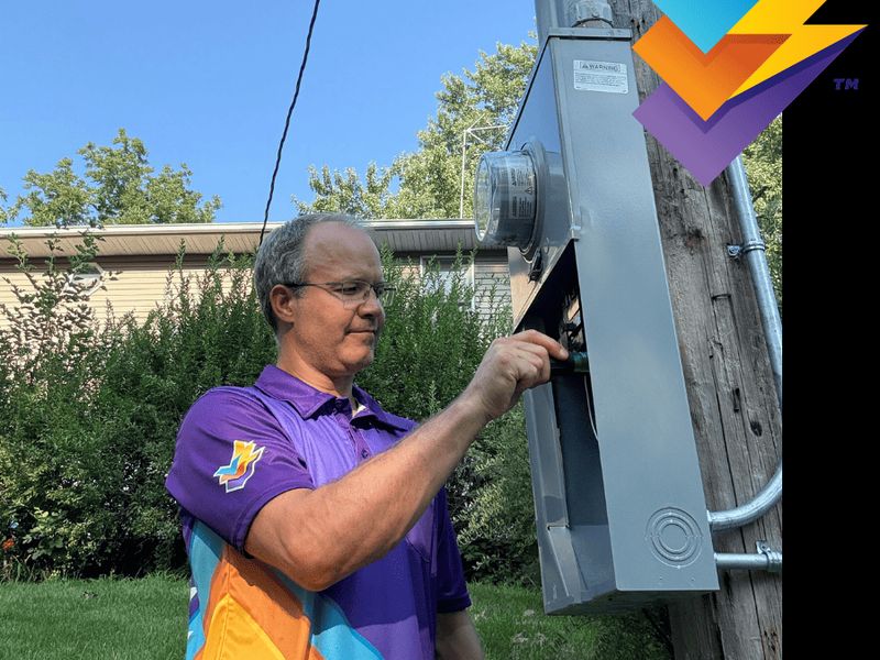 Triple Check Electric owner working at an outdoor electrical meter in Omaha